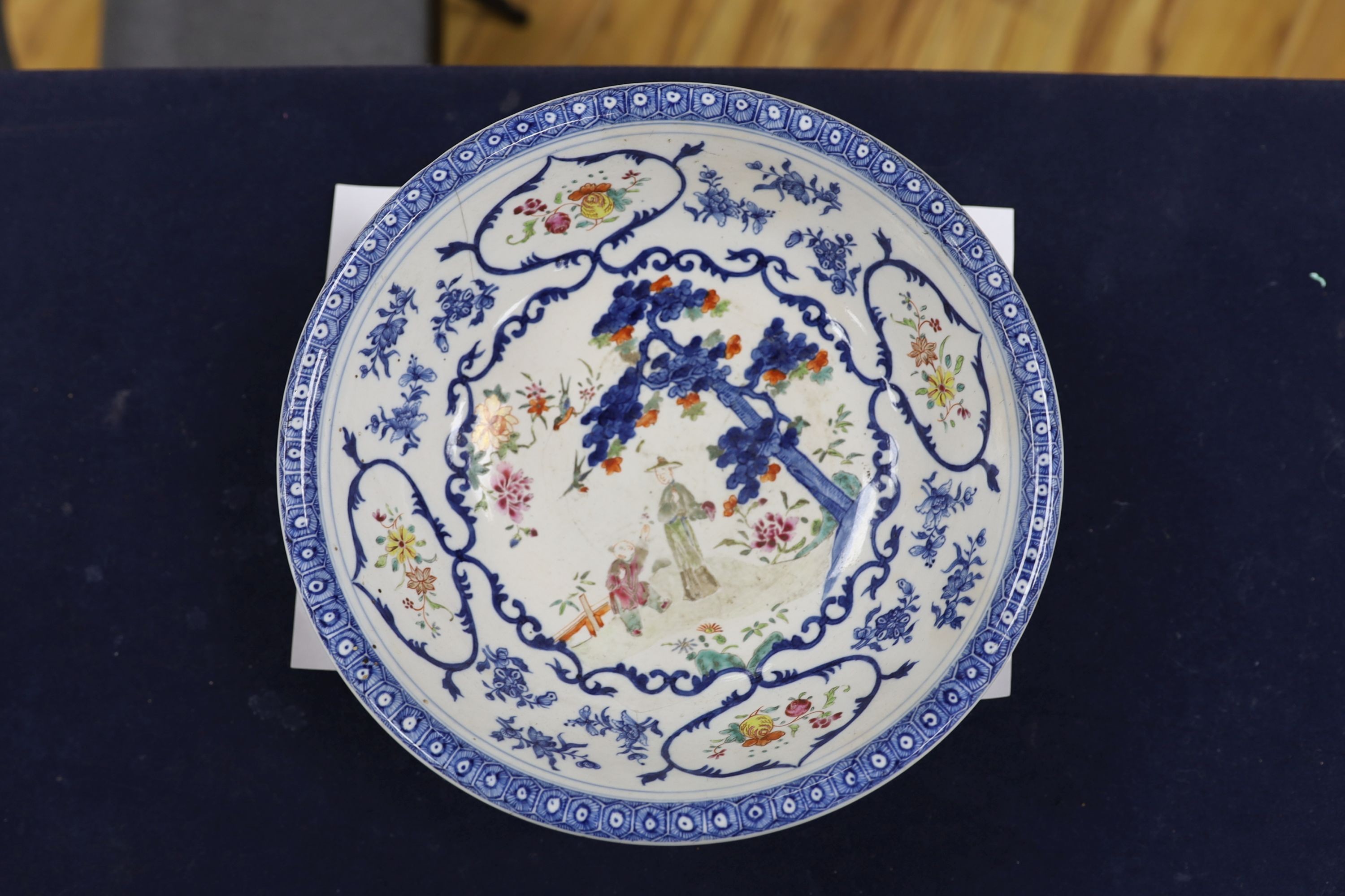 A Chinese underglaze blue and famille rose decorated basin or bowl, Qianlong period, 27 cm diameter